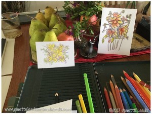 Photo of pencils and two watercolours