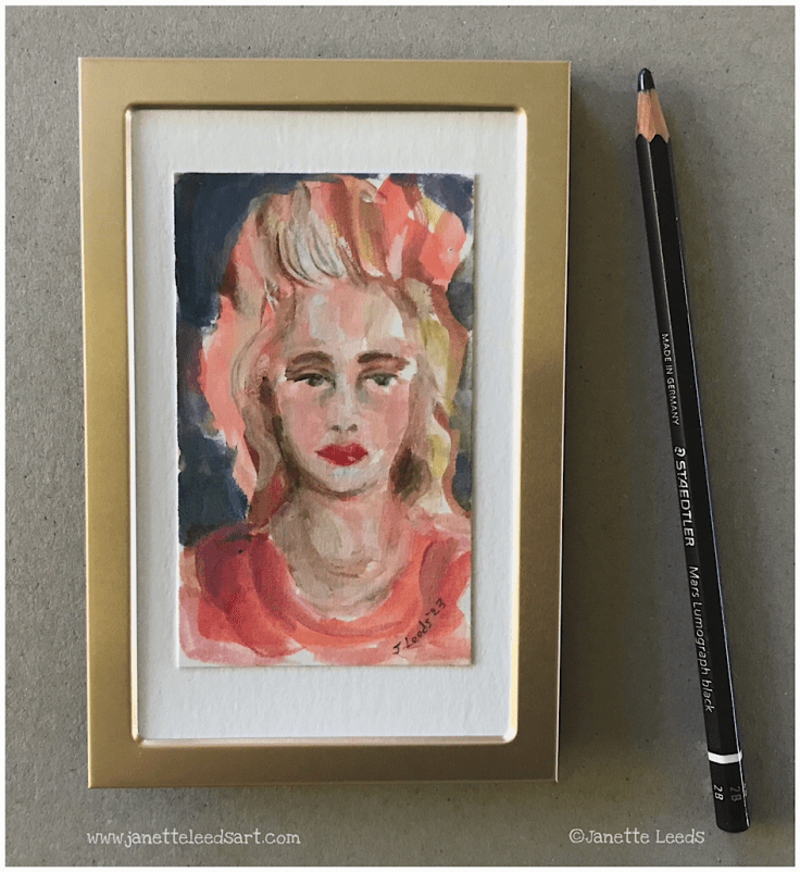Tiny painting of a woman’s face